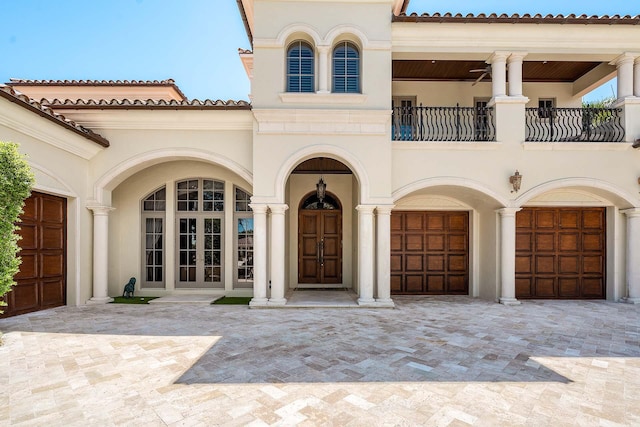 view of front of home featuring french doors and a balcony