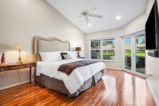 bedroom with ceiling fan, vaulted ceiling, wood-type flooring, access to outside, and french doors