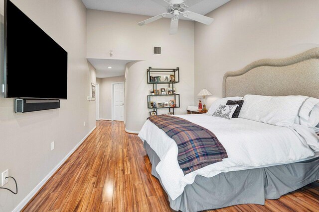 bedroom featuring hardwood / wood-style flooring and ceiling fan