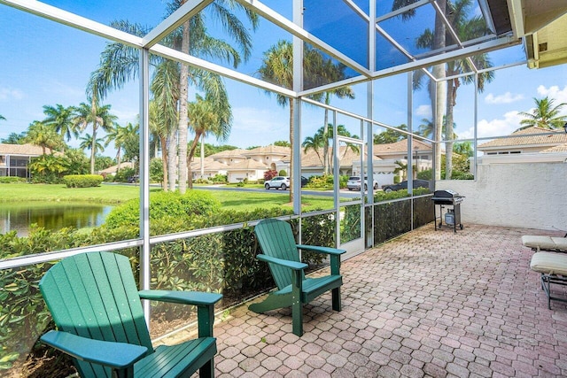 sunroom / solarium with a water view