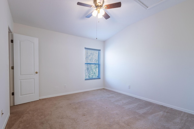 unfurnished room with light carpet, vaulted ceiling, and ceiling fan