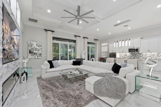 living room with coffered ceiling, light tile patterned floors, crown molding, and ceiling fan