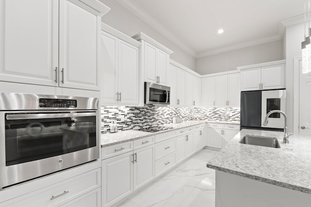 kitchen with sink, stainless steel appliances, and white cabinets