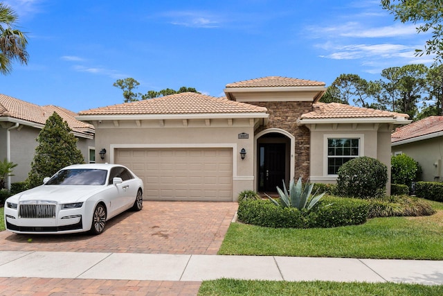 mediterranean / spanish home featuring a garage