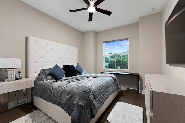 bedroom with dark wood-type flooring and ceiling fan