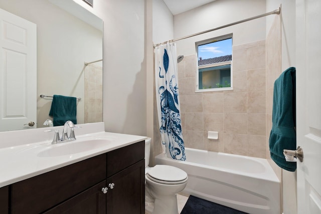 full bathroom with vanity, shower / tub combo, and toilet