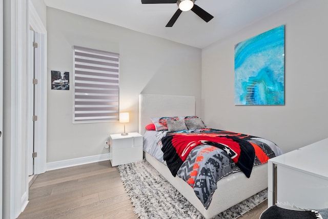 bedroom featuring ceiling fan and wood-type flooring