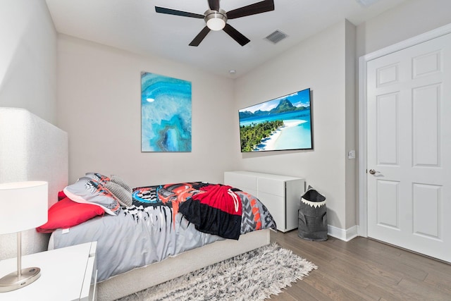 bedroom featuring hardwood / wood-style floors and ceiling fan