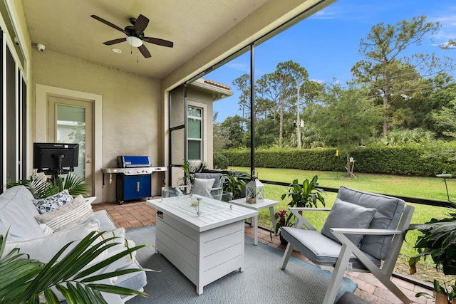 sunroom / solarium with ceiling fan