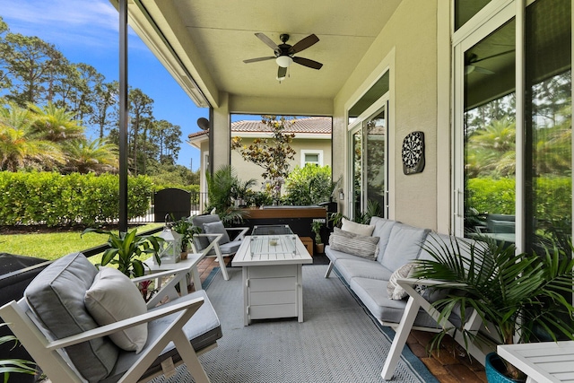 sunroom / solarium with ceiling fan