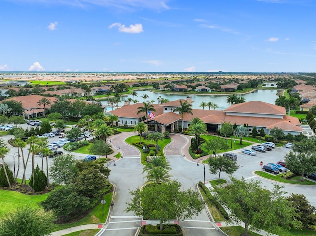 birds eye view of property featuring a water view