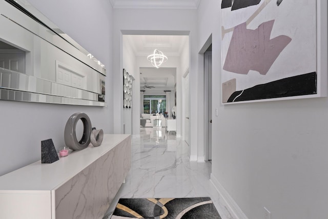 corridor with crown molding and a notable chandelier