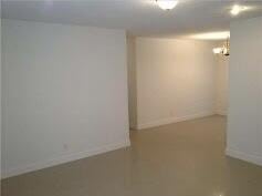 basement with an inviting chandelier