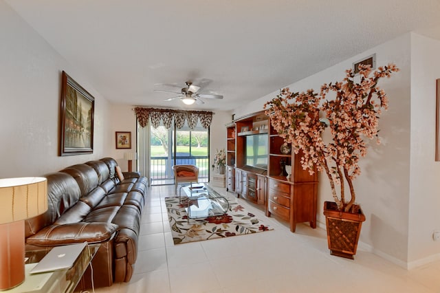 tiled living room with ceiling fan