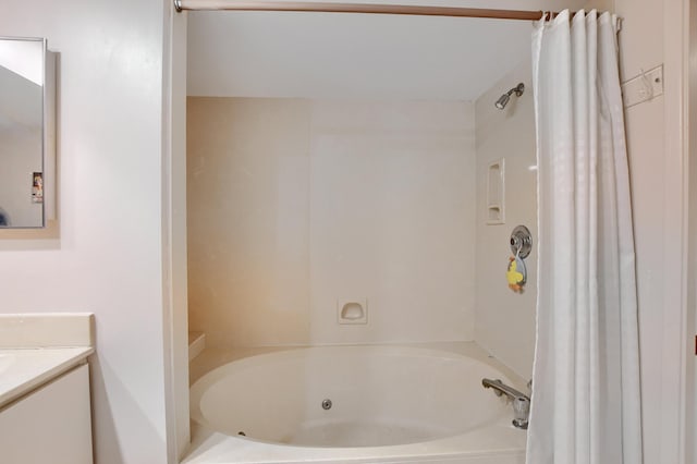 full bathroom featuring a combined bath / shower with jetted tub and vanity