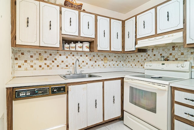 kitchen with white cabinets, white appliances, sink, and backsplash