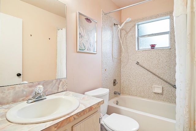 full bathroom with vanity, shower / tub combo, and toilet