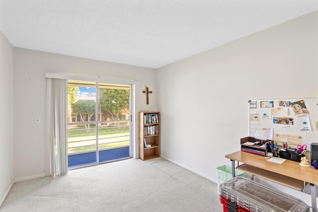 home office with baseboards, a textured ceiling, and carpet flooring