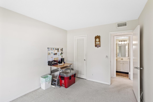 interior space with a closet, visible vents, and baseboards