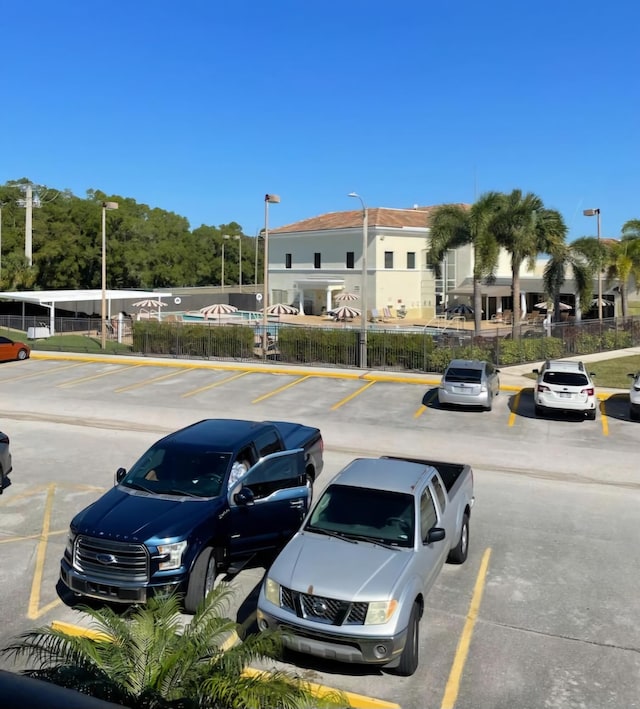 uncovered parking lot with fence