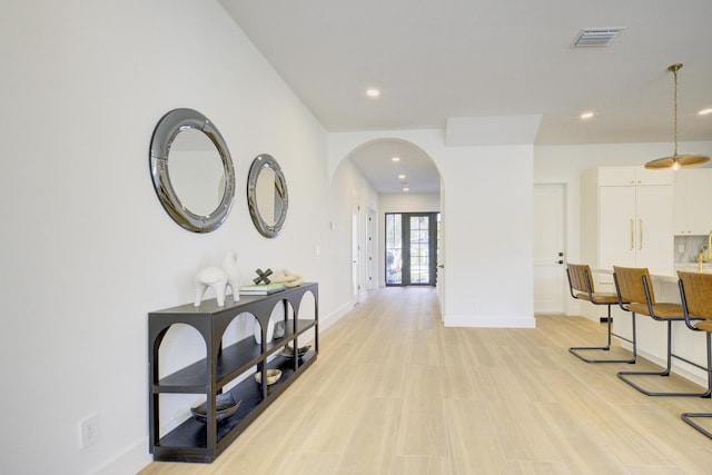 corridor featuring light hardwood / wood-style flooring