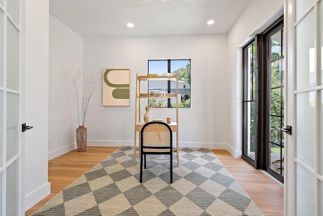 226 NE 11th St, Delray Beach, FL 33444 - entryway featuring baseboards, recessed lighting, light wood-style flooring, and arched walkways