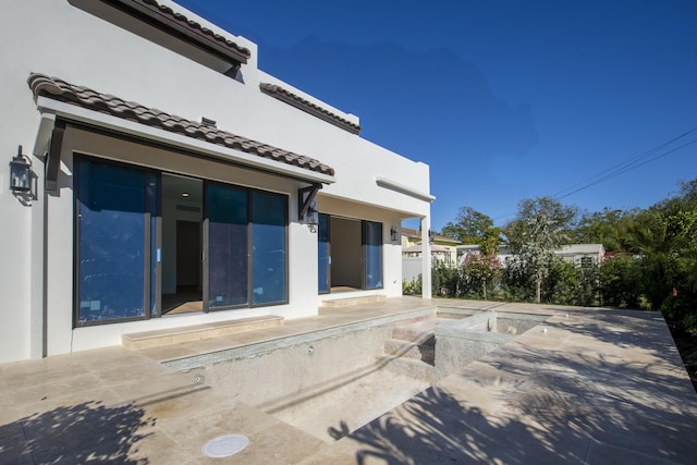 back of house featuring a patio area