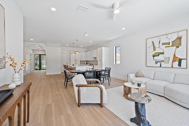 226 NE 11th St, Delray Beach, FL 33444 - bedroom featuring french doors, multiple windows, baseboards, recessed lighting, and light wood-style floors