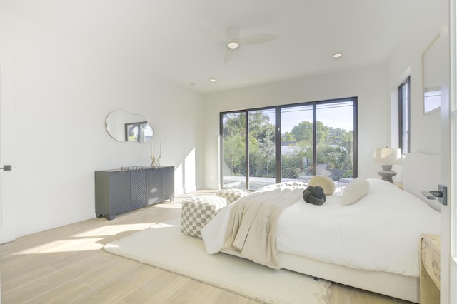 bedroom featuring ceiling fan, access to outside, and light wood-type flooring