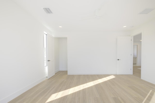 unfurnished room featuring light hardwood / wood-style floors