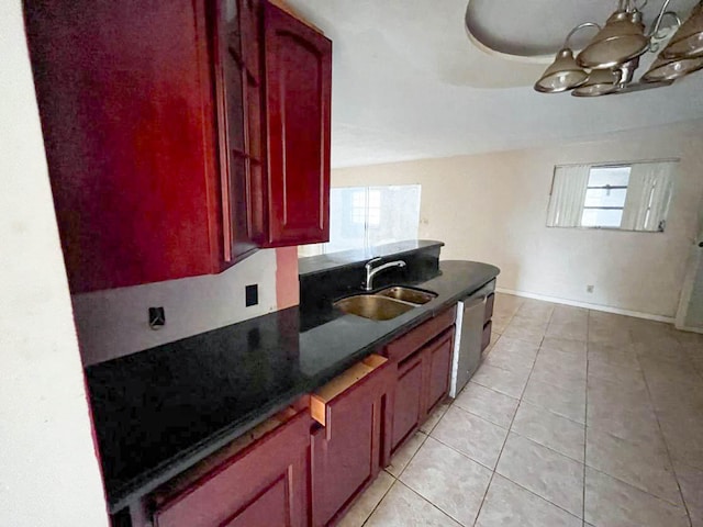 kitchen featuring sink, a chandelier, dishwasher, and light tile patterned floors