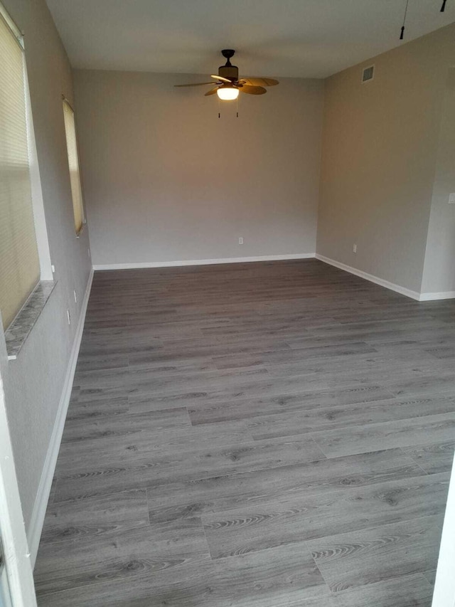 unfurnished room with ceiling fan and hardwood / wood-style floors