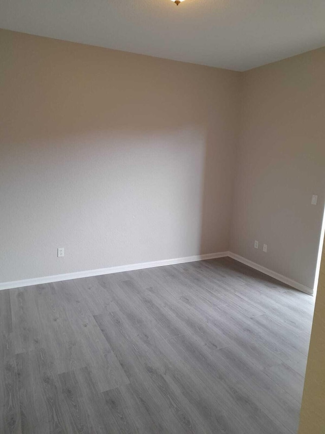 spare room featuring hardwood / wood-style flooring