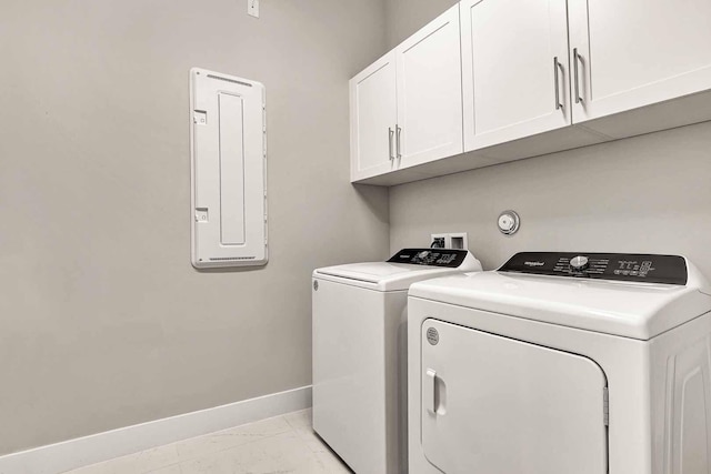 laundry area featuring cabinets and washing machine and dryer