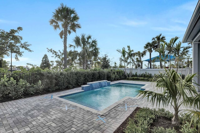 view of pool featuring a patio and pool water feature