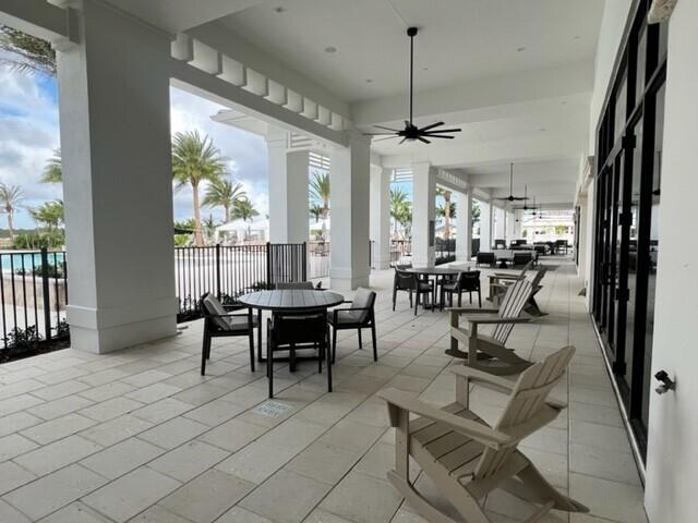 view of patio featuring ceiling fan