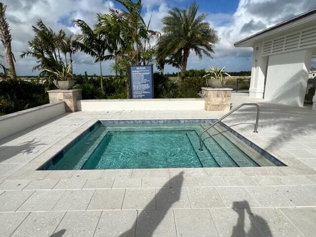 view of swimming pool featuring a patio area