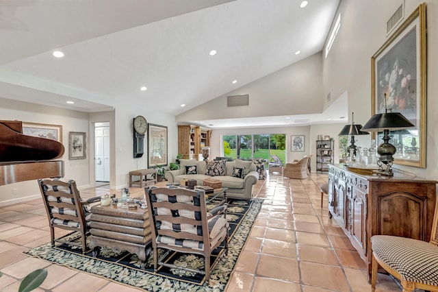 tiled living room featuring high vaulted ceiling