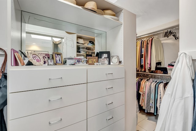 spacious closet featuring light tile patterned flooring