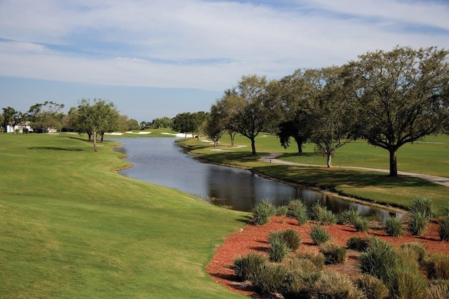 view of home's community featuring a yard and a water view