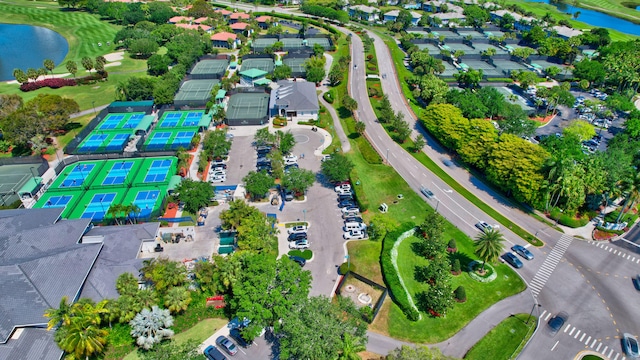 birds eye view of property with a water view