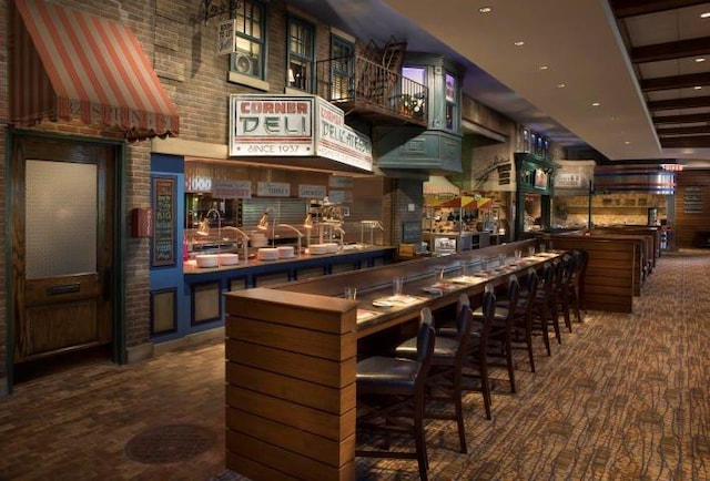 bar featuring a towering ceiling