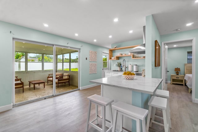 9531 Birdwood St, Palm Beach Gardens, FL 33410 - kitchen with open shelves, plenty of natural light, white cabinetry, light wood-type flooring, and recessed lighting
