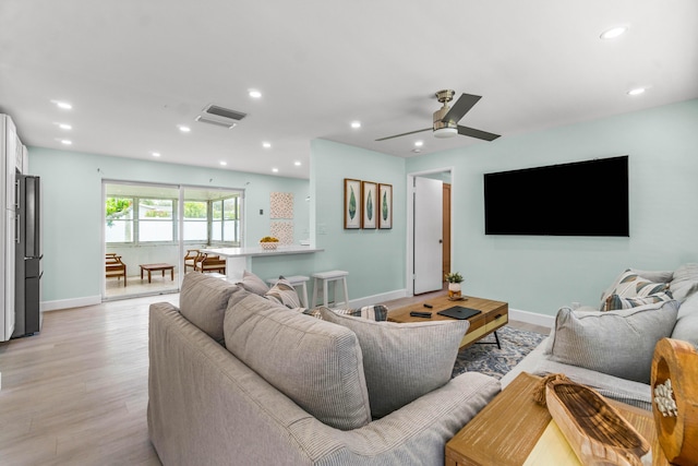 9531 Birdwood St, Palm Beach Gardens, FL 33410 - living room featuring light wood-style floors, baseboards, recessed lighting, and ceiling fan
