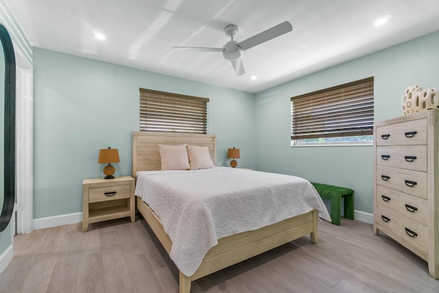 9531 Birdwood St, Palm Beach Gardens, FL 33410 - bedroom with baseboards, light wood finished floors, a ceiling fan, and recessed lighting