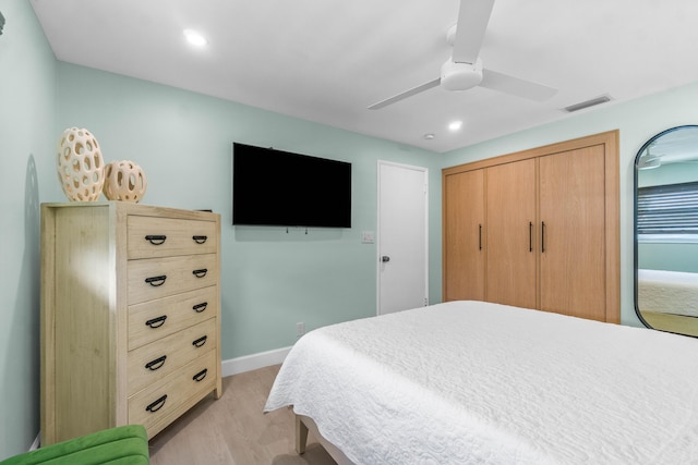 9531 Birdwood St, Palm Beach Gardens, FL 33410 - bedroom with light wood-type flooring, a ceiling fan, recessed lighting, and baseboards