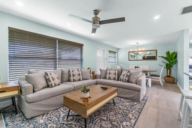 9531 Birdwood St, Palm Beach Gardens, FL 33410 - living area with a chandelier, ceiling fan, light wood-style floors, and recessed lighting