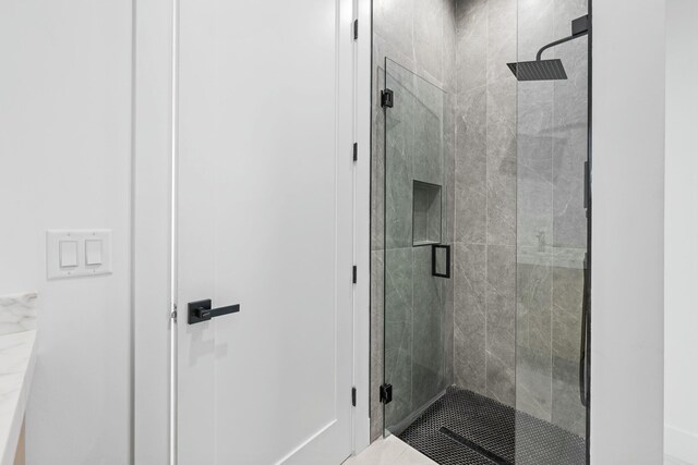 bathroom with an enclosed shower