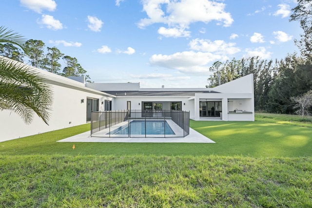 back of house with a yard and a patio area