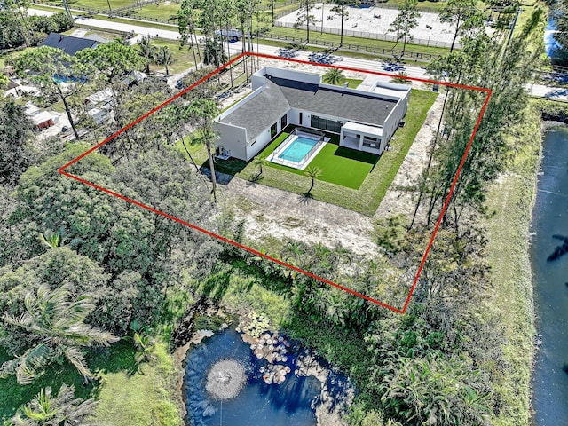 birds eye view of property featuring a water view